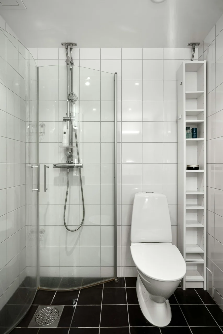 How to Organize a Small Bathroom Without Installing More Cabinets interior: 6. Adopt a “One In, One Out” Routine Paired with Clear Storage Containers - Even the most intelligently designed space can become chaotic if the volume of products exceeds the storage capacity. Establishing a habit where every new bottle that enters the bathroom replaces an existing one keeps the