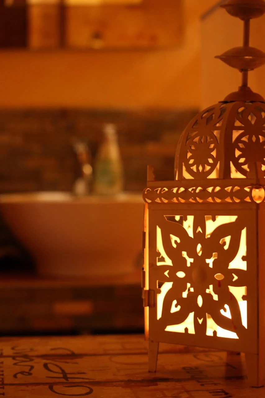 How to Organize a Small Bathroom Without Installing More Cabinets interior: 7. Layer Lighting to Highlight Storage Zones and Create Depth - Good lighting does more than illuminate; it defines zones and can make a cramped bathroom feel airy. Installing a narrow LED strip along the underside of a floating shelf adds a soft wash of light