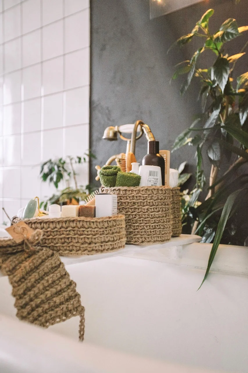 How to Organize a Small Bathroom Without Installing More Cabinets interior: FAQ - How can I keep open shelves from looking messy? Use uniform containers and limit the number of items displayed. By grouping similar products together, the shelf maintains a tidy appearance while still offering easy access.
