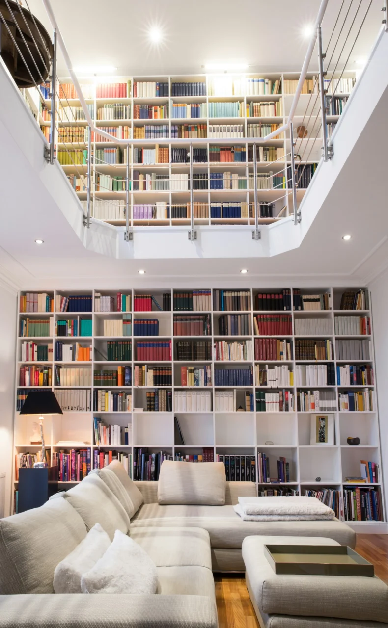 Living Room Storage Ideas That Don't Look Like Storage interior: 6. Use an oversized ottoman with a removable lid - An ottoman large enough to serve as an extra seat or footrest can also function as a storage bin when its top lifts away. Choose a fabric in a muted hue—perhaps a soft greige or
