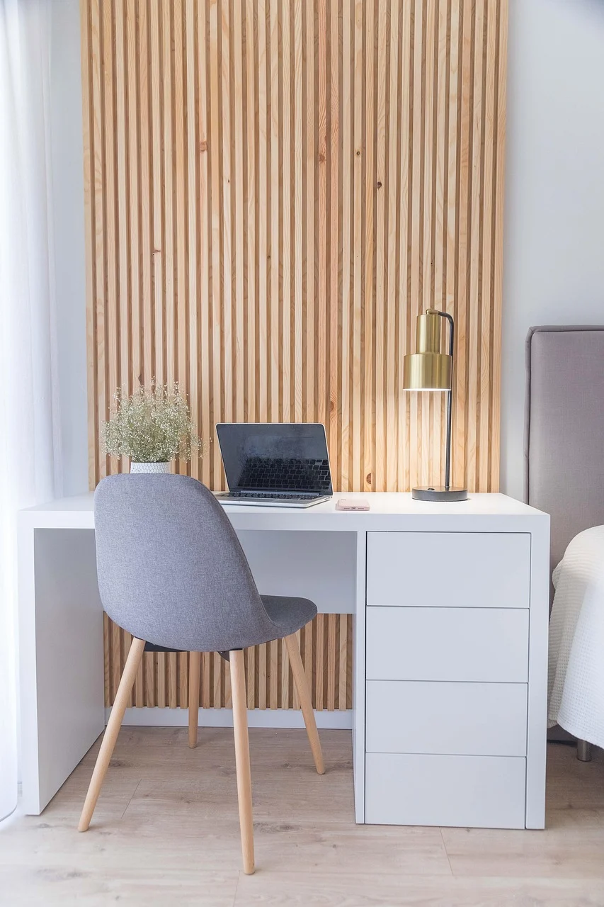Modern minimalist bedroom floor to ceiling walnut wardrobe with sleek sliding doors and built in